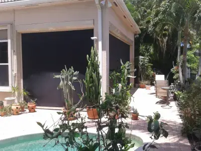 SuperMax roll-down hurricane system protecting a large lanai in a Florida gated community